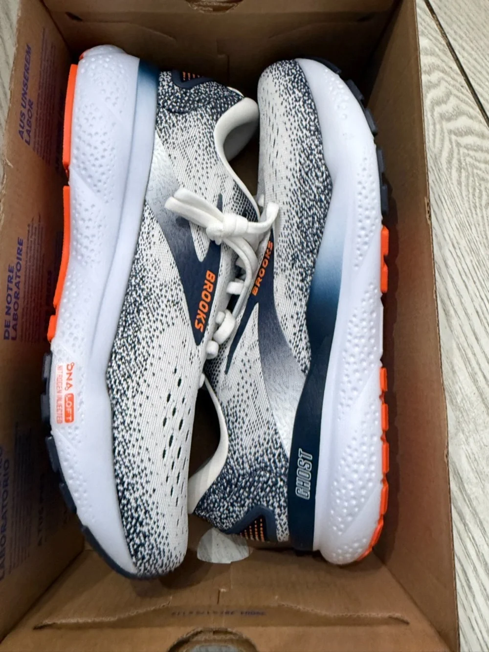 Brooks White and Navy Running Shoes with Orange Logo Accents
